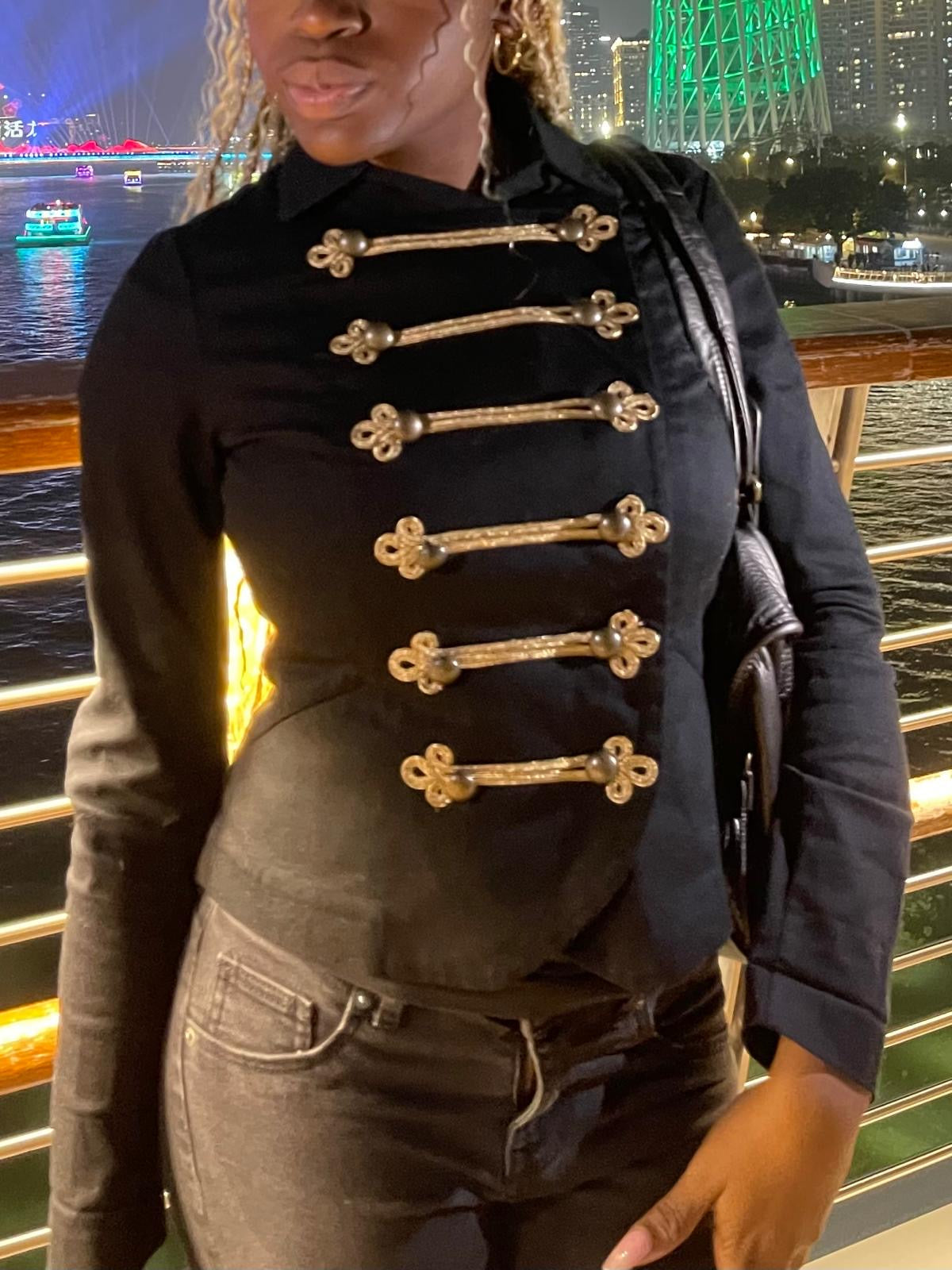 black military-style fitted jacket with gold detailing